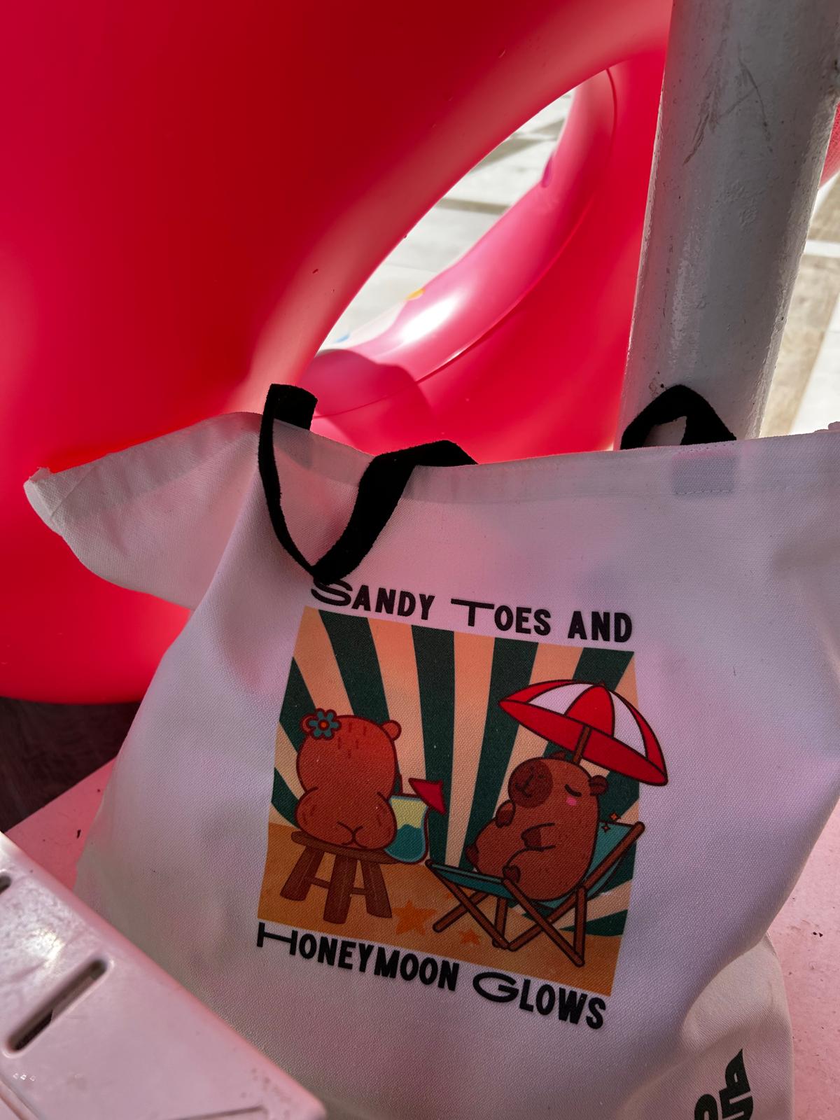 Large Delamo honeymoon travel tote bag packed with beach towels and vacation essentials, hand-pressed in Ireland.